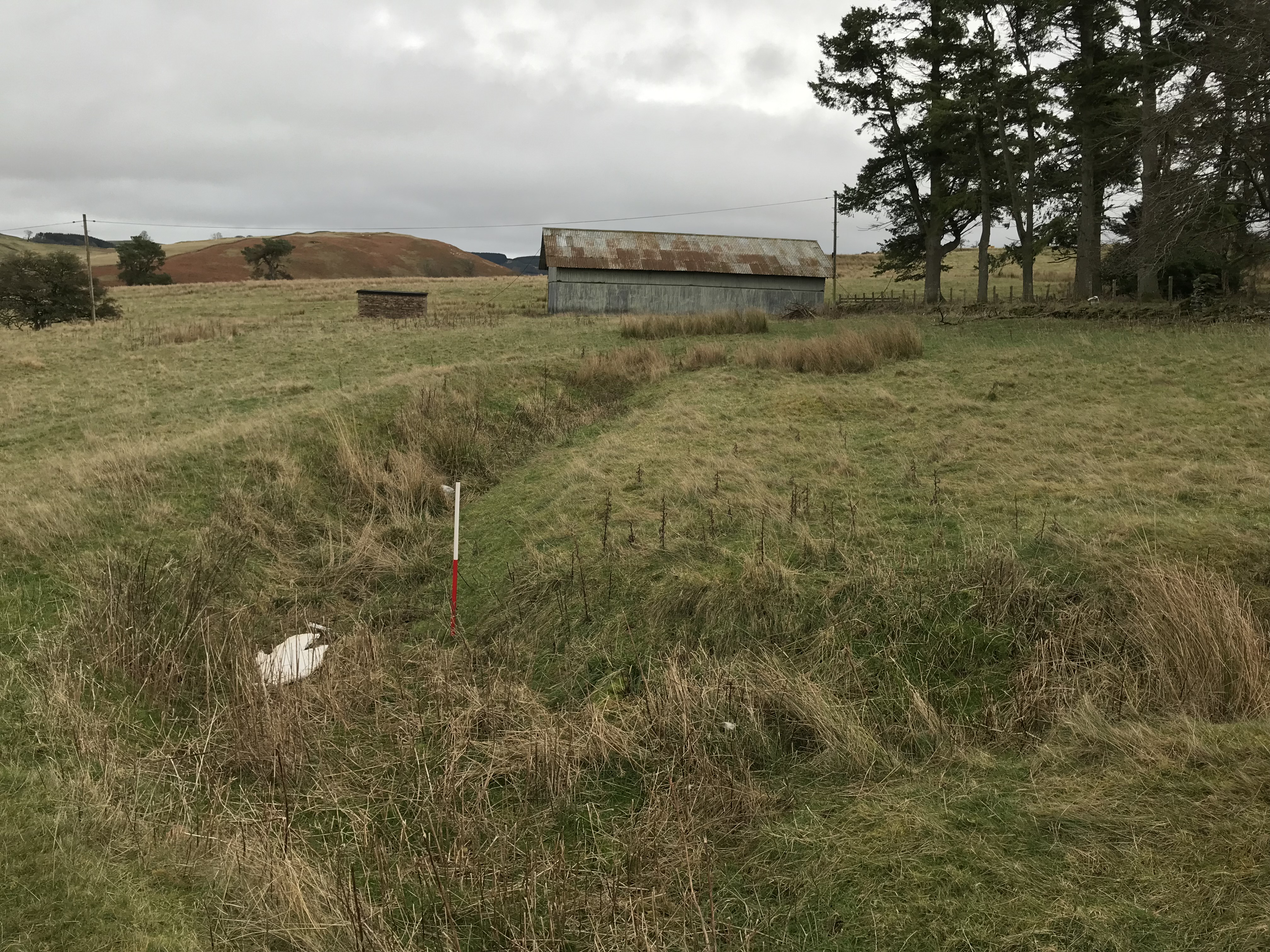 Stobs Camp, view of practice trenches and pre-WW1 storage hut behind 